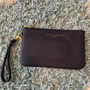 Dark navy charging wristlet wallet.